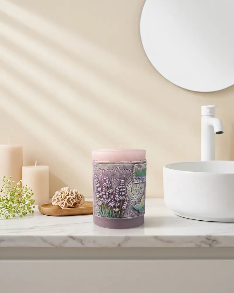 The lilac pillar candle on a marble bathroom vanity beside a round white basin, made with Nano Banana 2.
